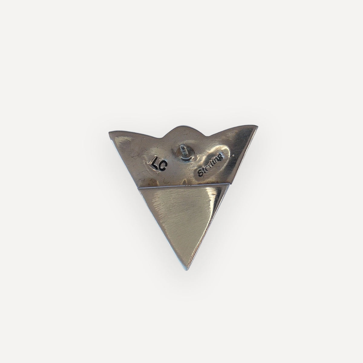 Back of two sterling silver bluebonnet collar tips showing secure clutch pin backings