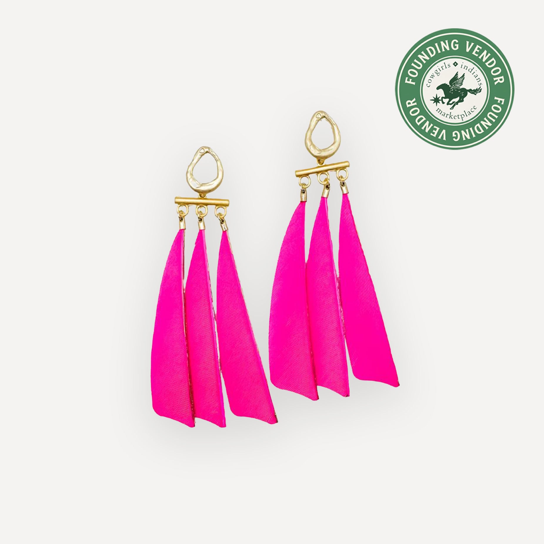 Pink feather earrings with gold hooks on a white background, featuring a Founding Vendor logo.