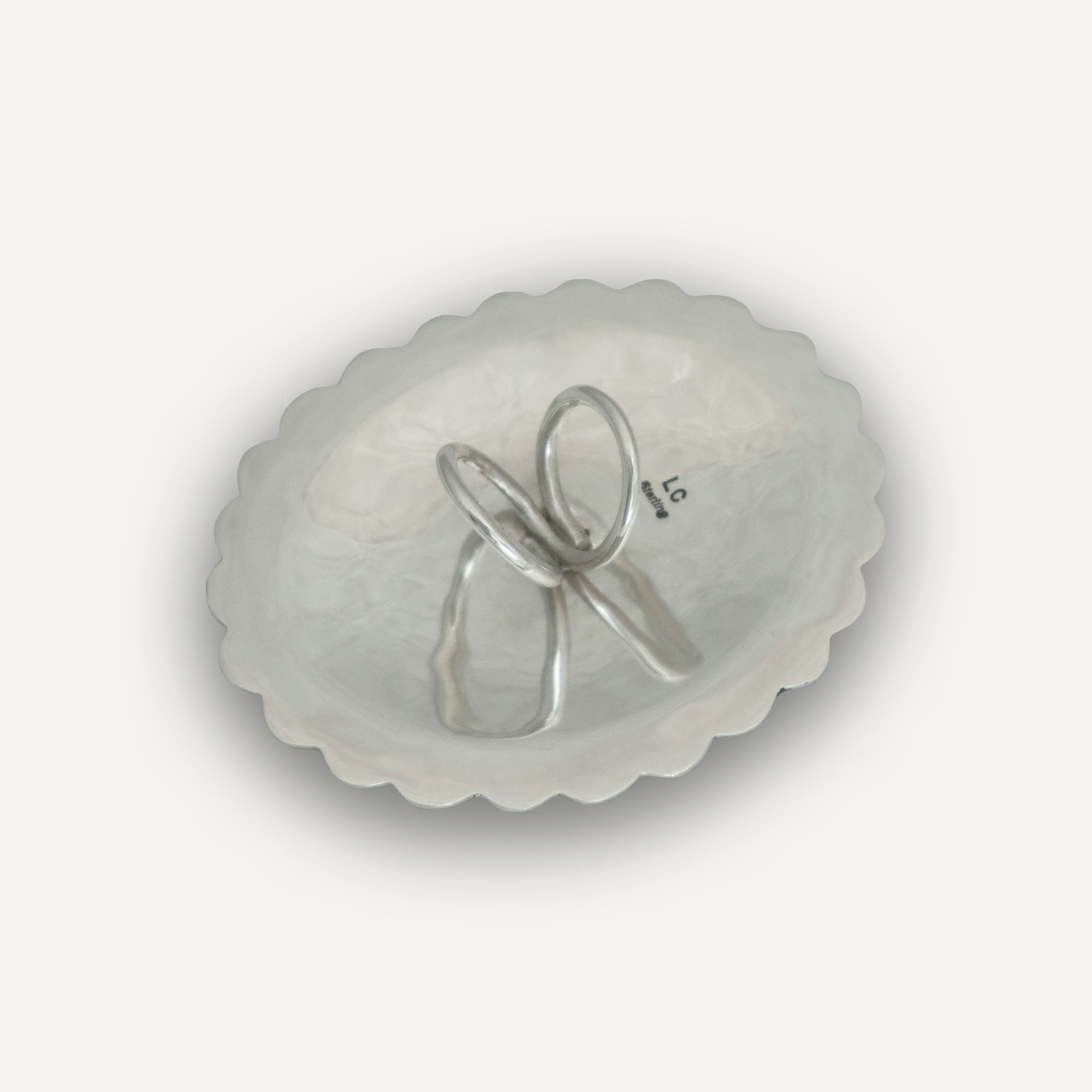 Back of a Navajo Concho with Native American Hallmark