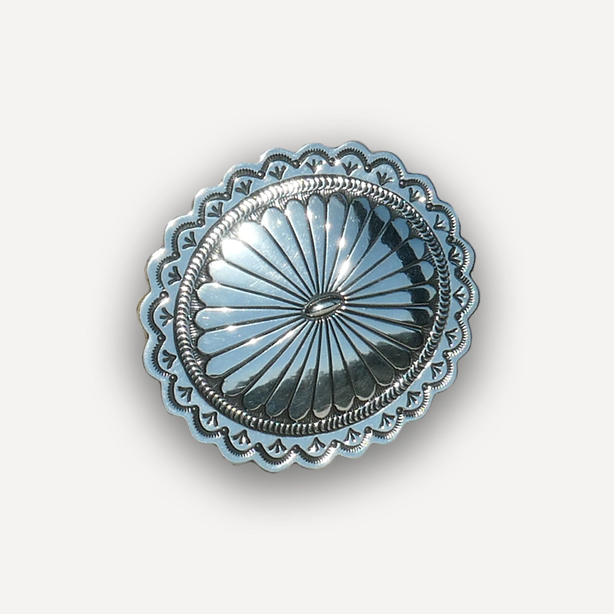 Handstamped Navajo Concho Scarf Ring on Light Background