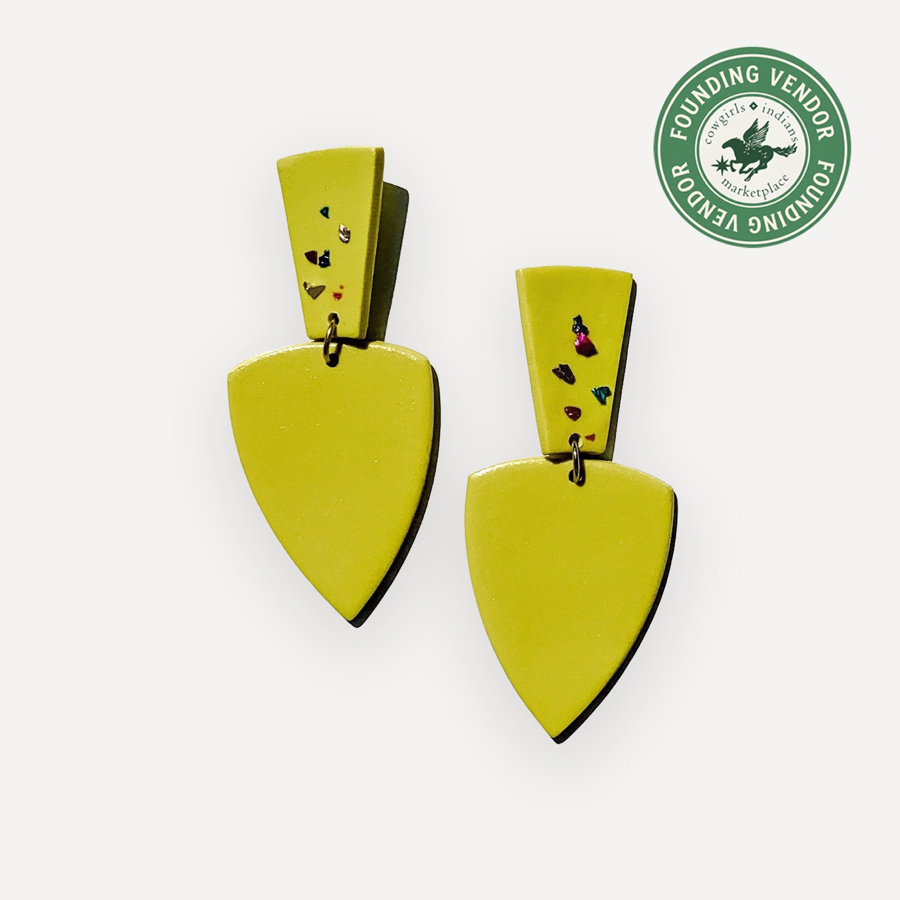 Pair of chartreuse earrings on a white background with a green badge in the corner.