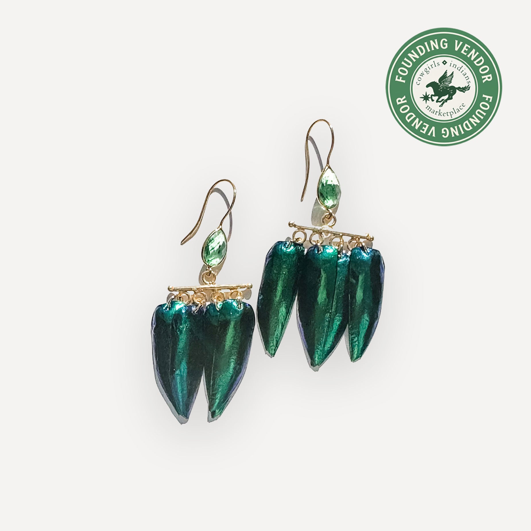 Green earrings on a white background with a Founding Vendor logo.