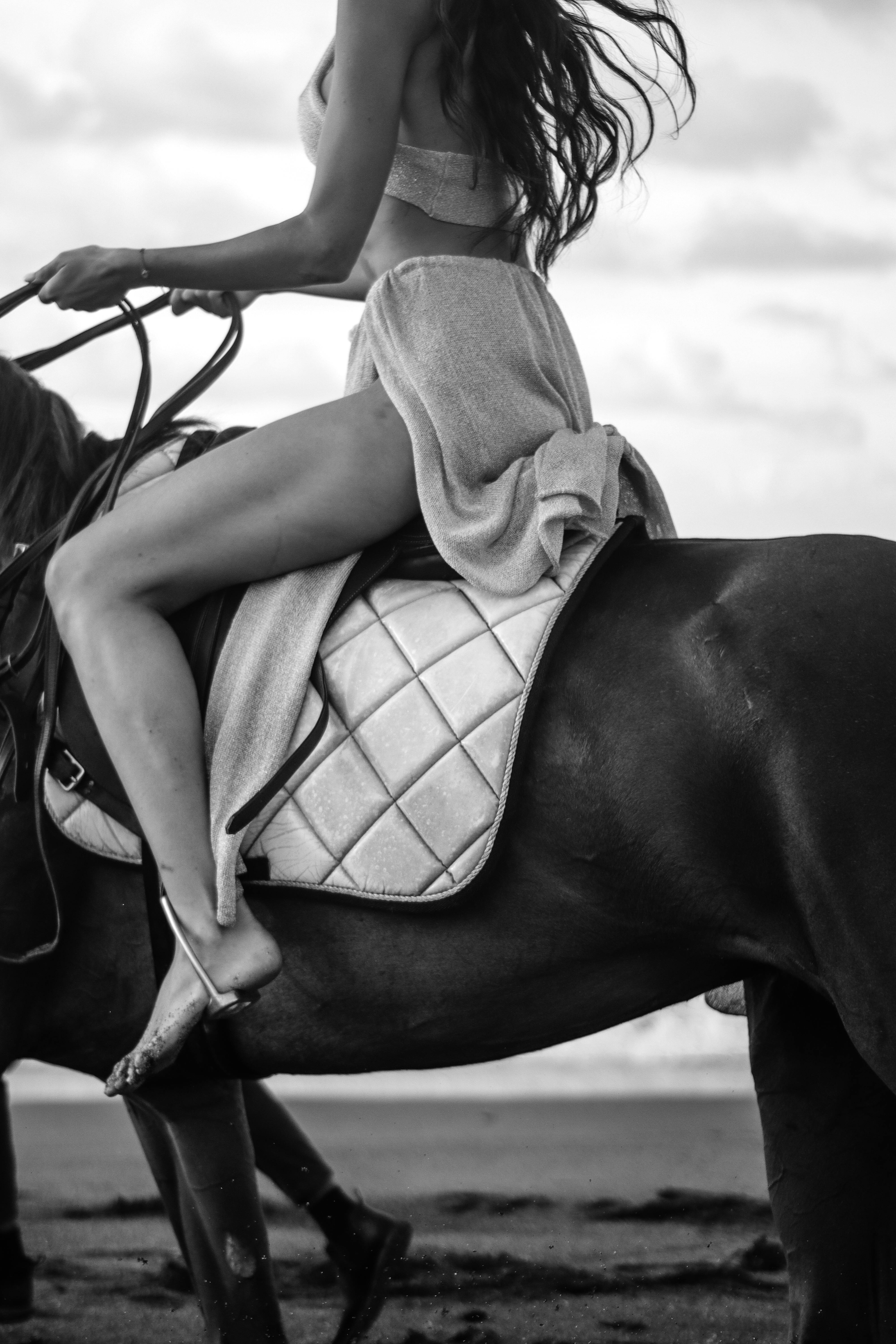 Fashion Editorial Photograph of a Woman Equestrian Horseback on the Beach