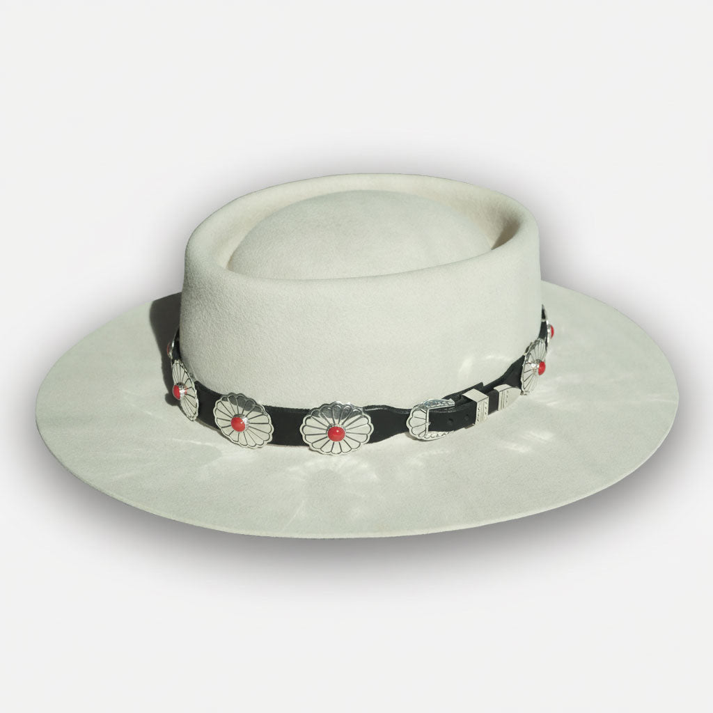 Silver western hat with leather and conchos hat band on white background