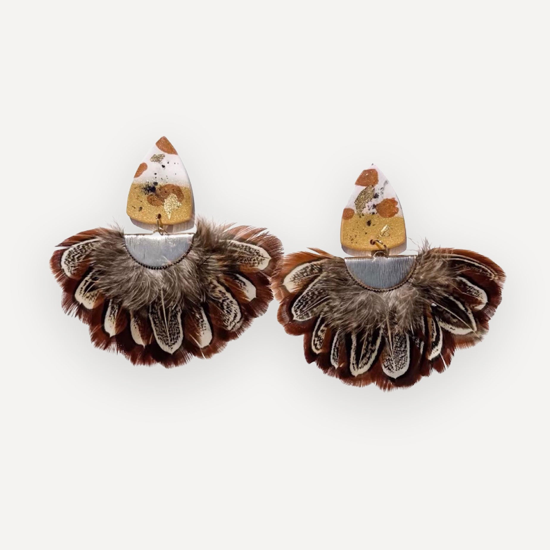 Pheasant fan earrings on white background
