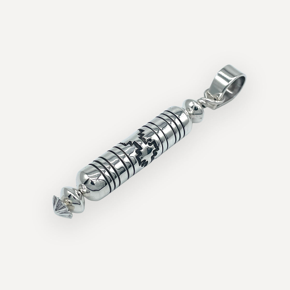 Barrel bead mesa pendant on a black leather cord displayed on a white necklace bust