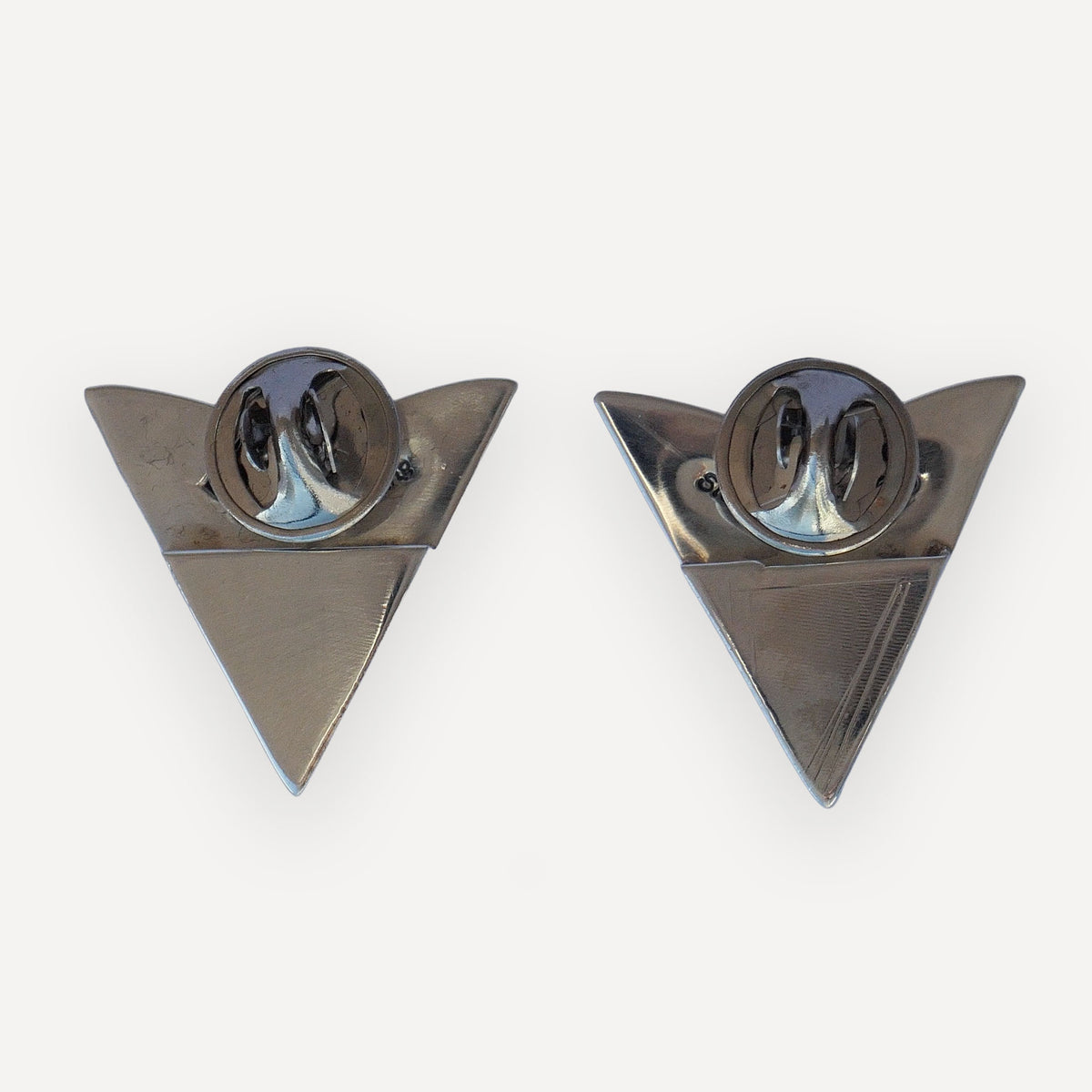 Back of a sterling silver bluebonnet collar tip with Sterling and LC hallmark stamps