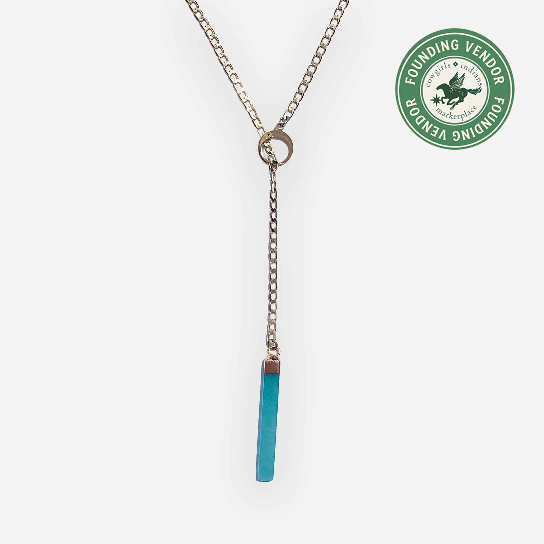 Gold Necklace with a jade pendant bar on a white background