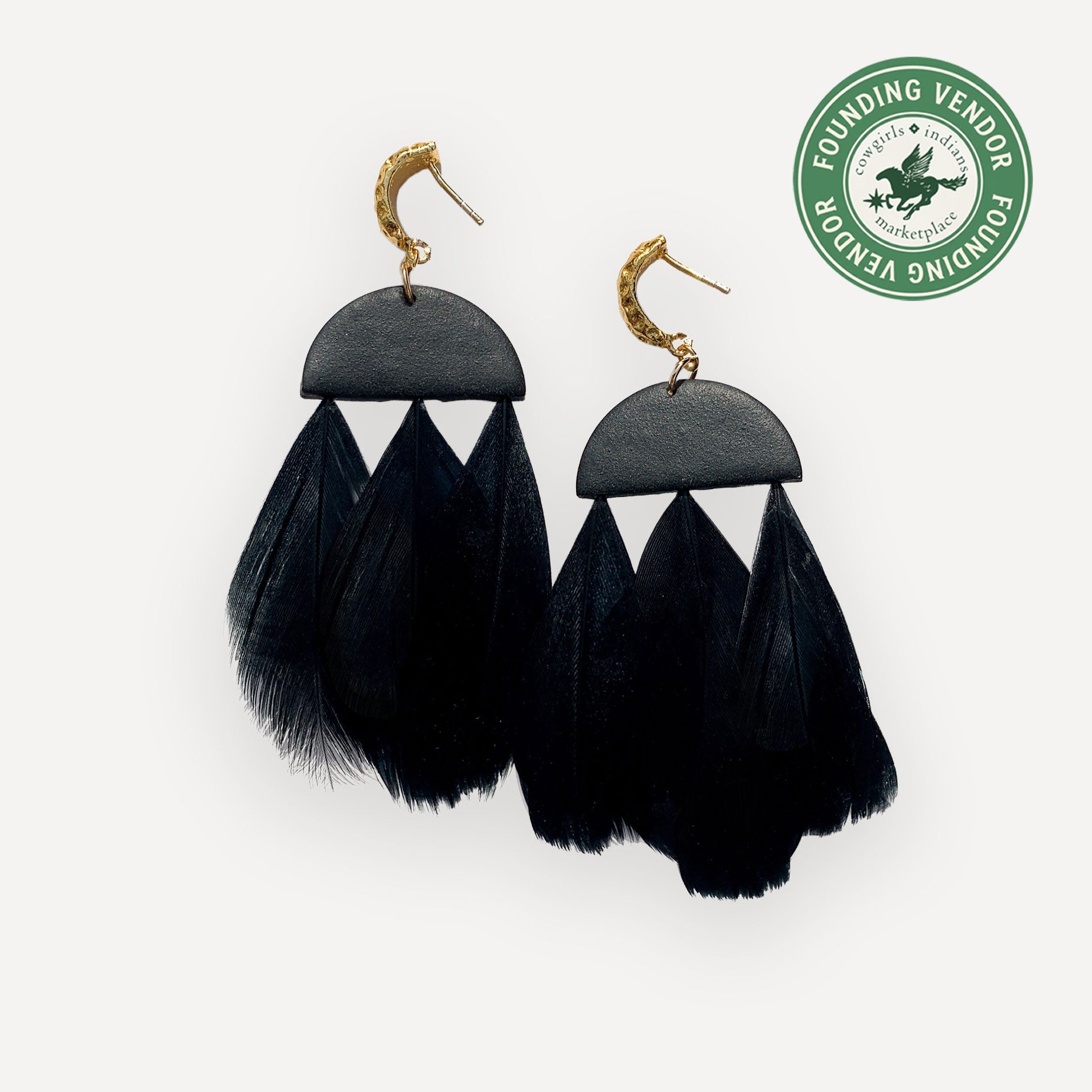 Black earrings on white background