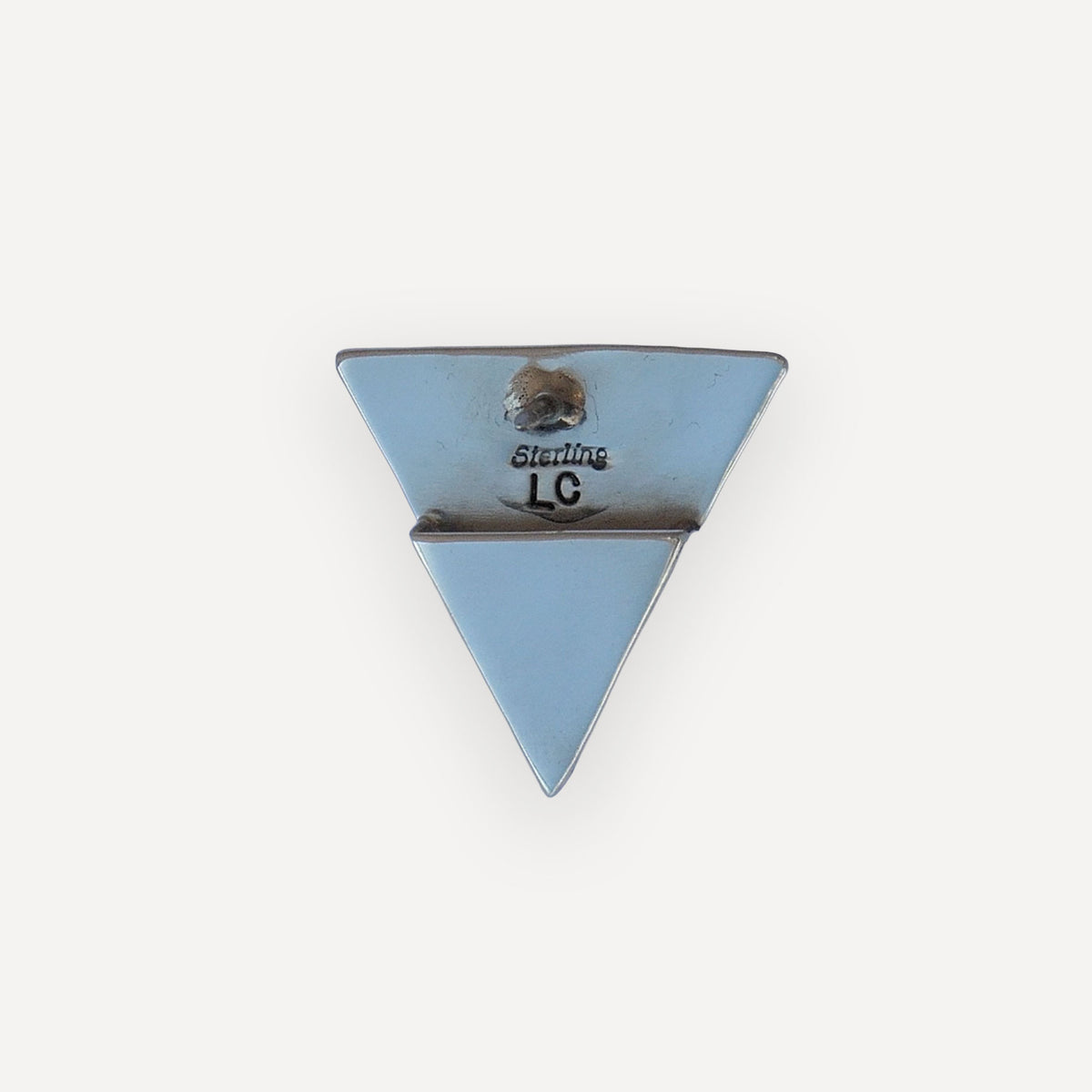 Back of two sterling silver lone star collar tips showing secure clutch pin backings
