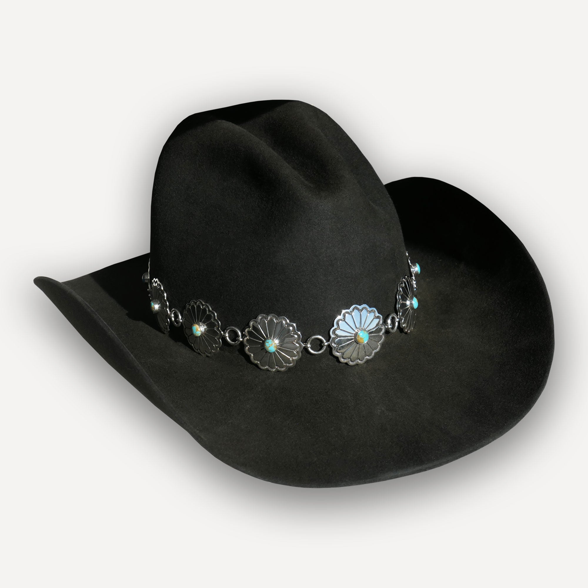 Navajo sterling silver and turquoise concho hatband displayed on a Kemo Sabe charcoal beaver blend cowboy hat with a cowboy curled brim and a gus crown shape. 