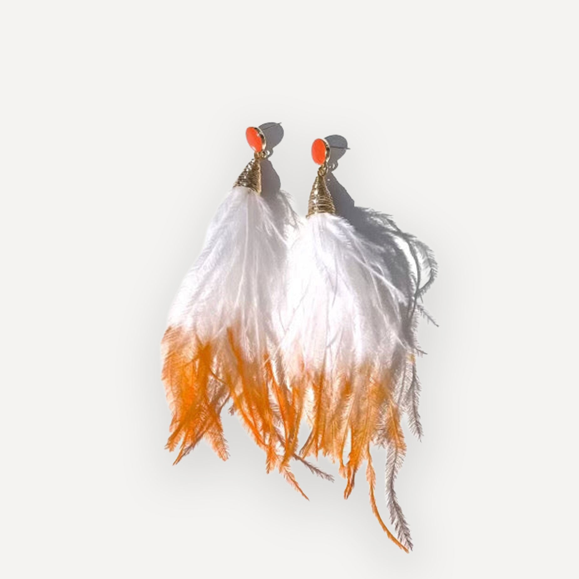 The Orange Crush Tassel Earrings with Carnelian on white background