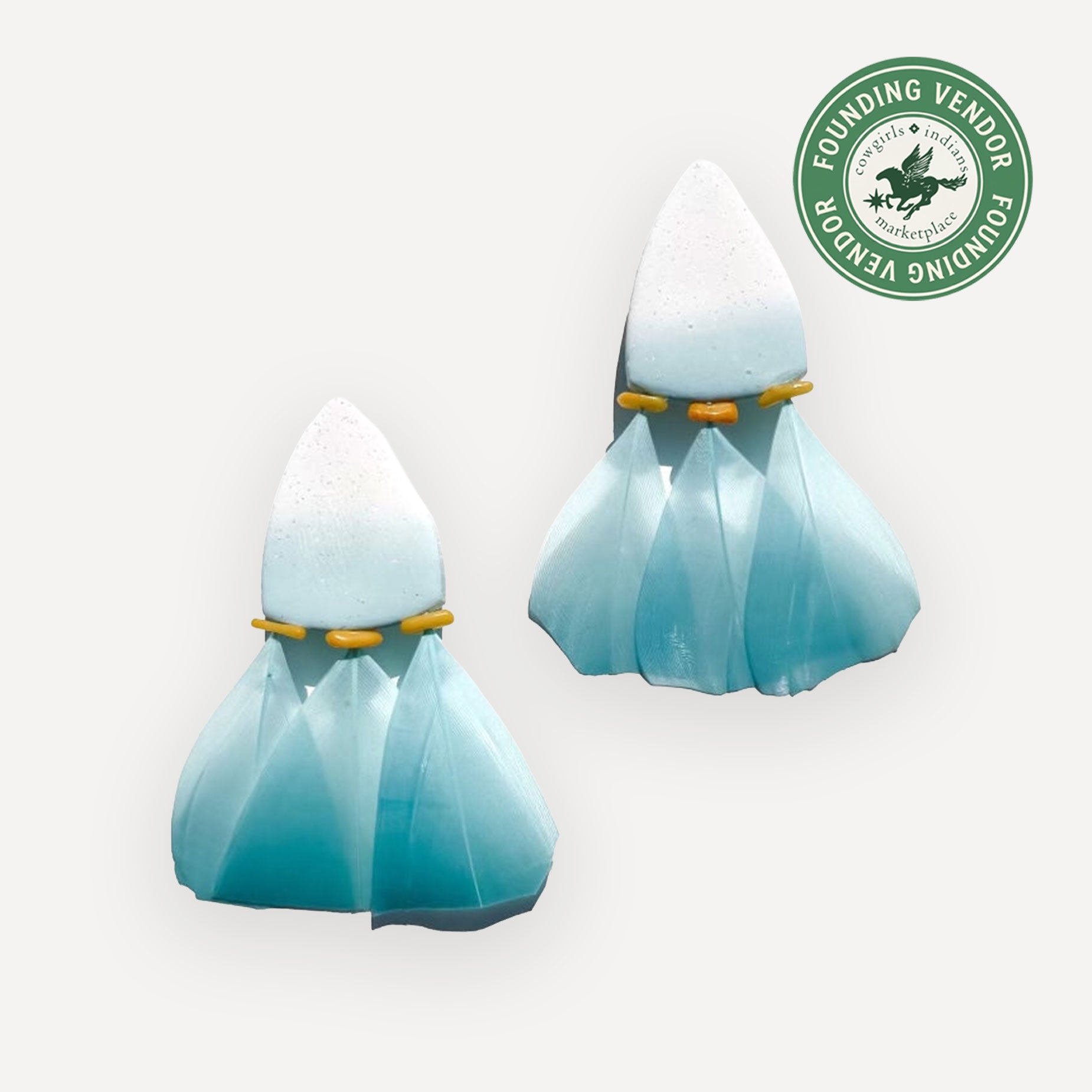 Clay and feather earrings in Aqua on white background