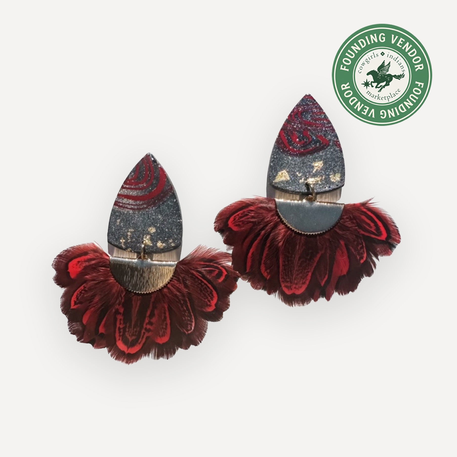 Pair of red and gray earrings with decorative elements on a white background, featuring a 'Founding Vendor' label.