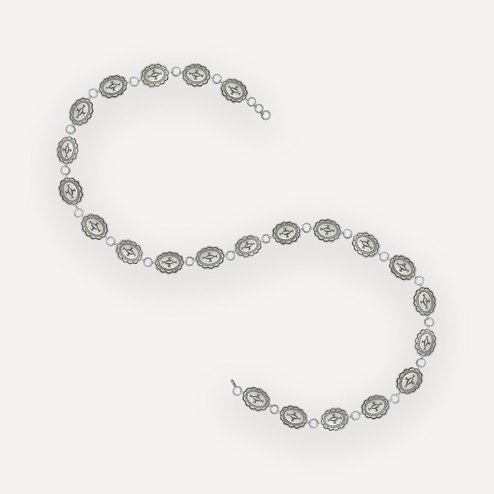 Navajo Concho Link Belt with handstamped accents in sterling silver on white background